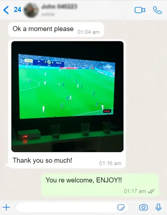 WhatsApp chat: a customer sends a photo of a football match playing on their TV and says "Thank you so much!"